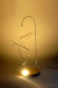 Nature sculpture by Ryan Weiss of Loamworks | Suspended Fall - made from found branches steel, birch, LED light