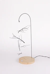 Nature sculpture by Ryan Weiss of Loamworks | Suspended Fall - made from found branches steel, birch, LED light
