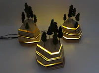 Nature sculpture by Ryan Weiss of Loamworks | Magic Mountain Lamp made of wood, acrylic, twigs, fiber and LED lights