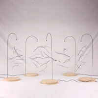 Nature sculpture by Ryan Weiss of Loamworks | Suspended Fall - made from found branches steel, birch, LED light